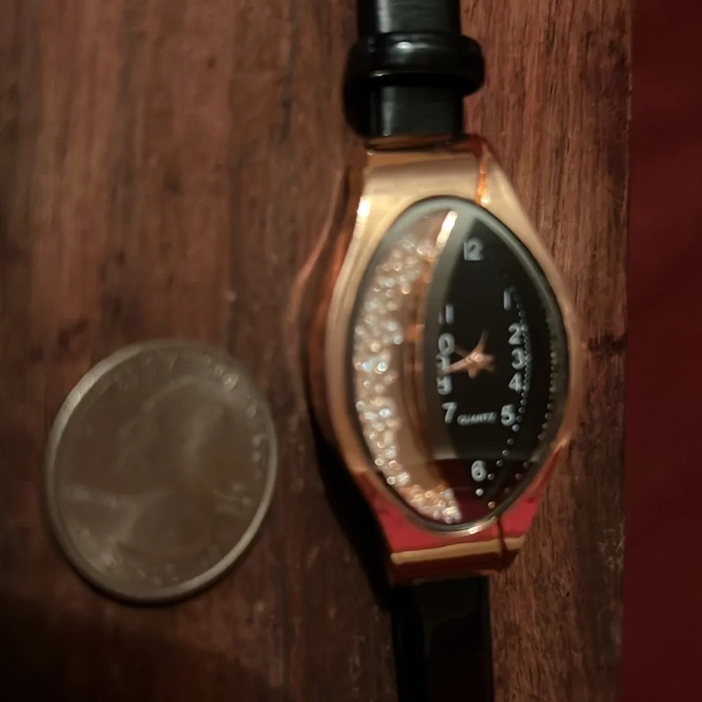 fashion watch with cz floating inside watch face ,‎ very beautiful